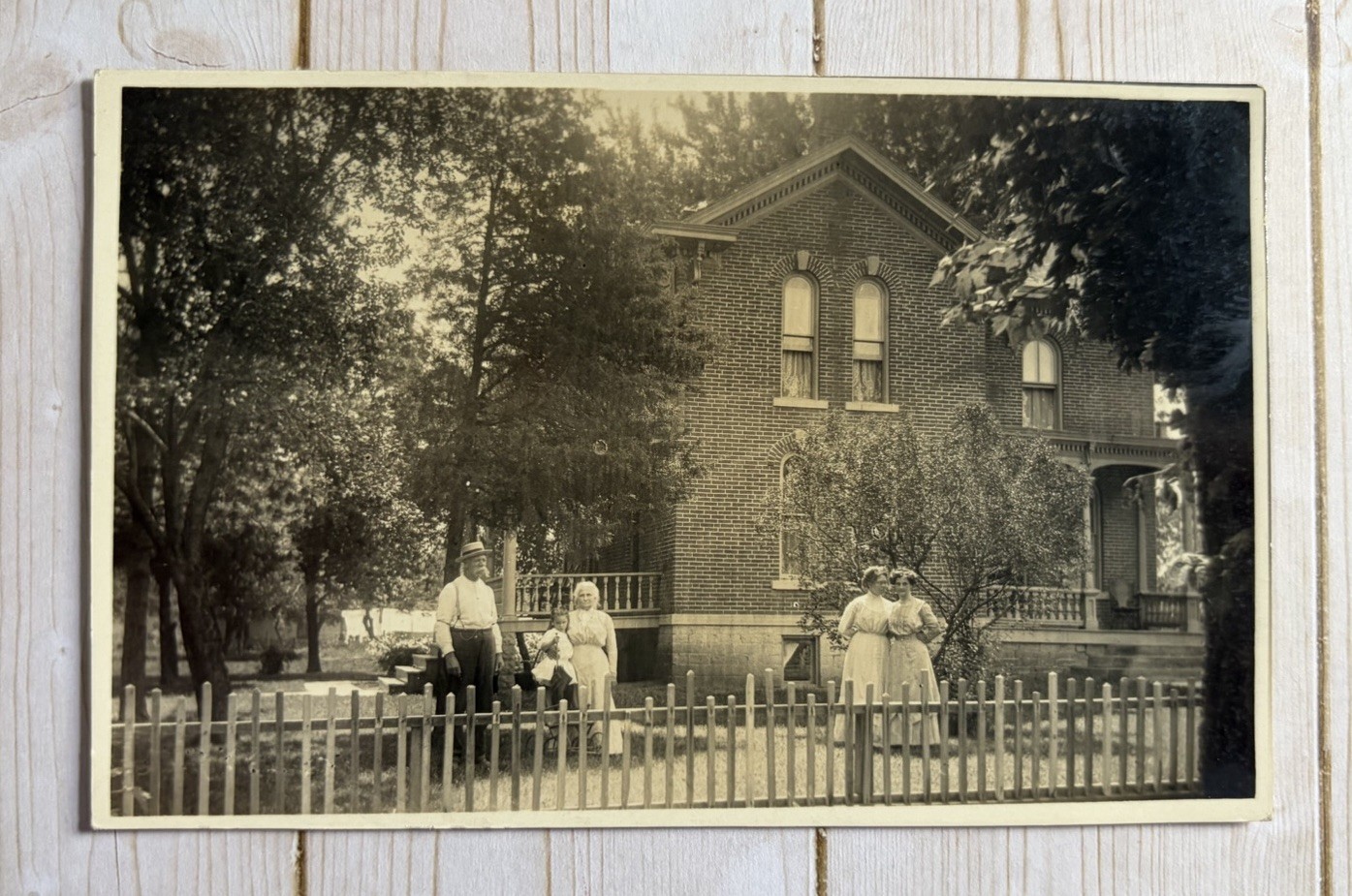 Antique RPPC Family Posing In Front Stately Brick House