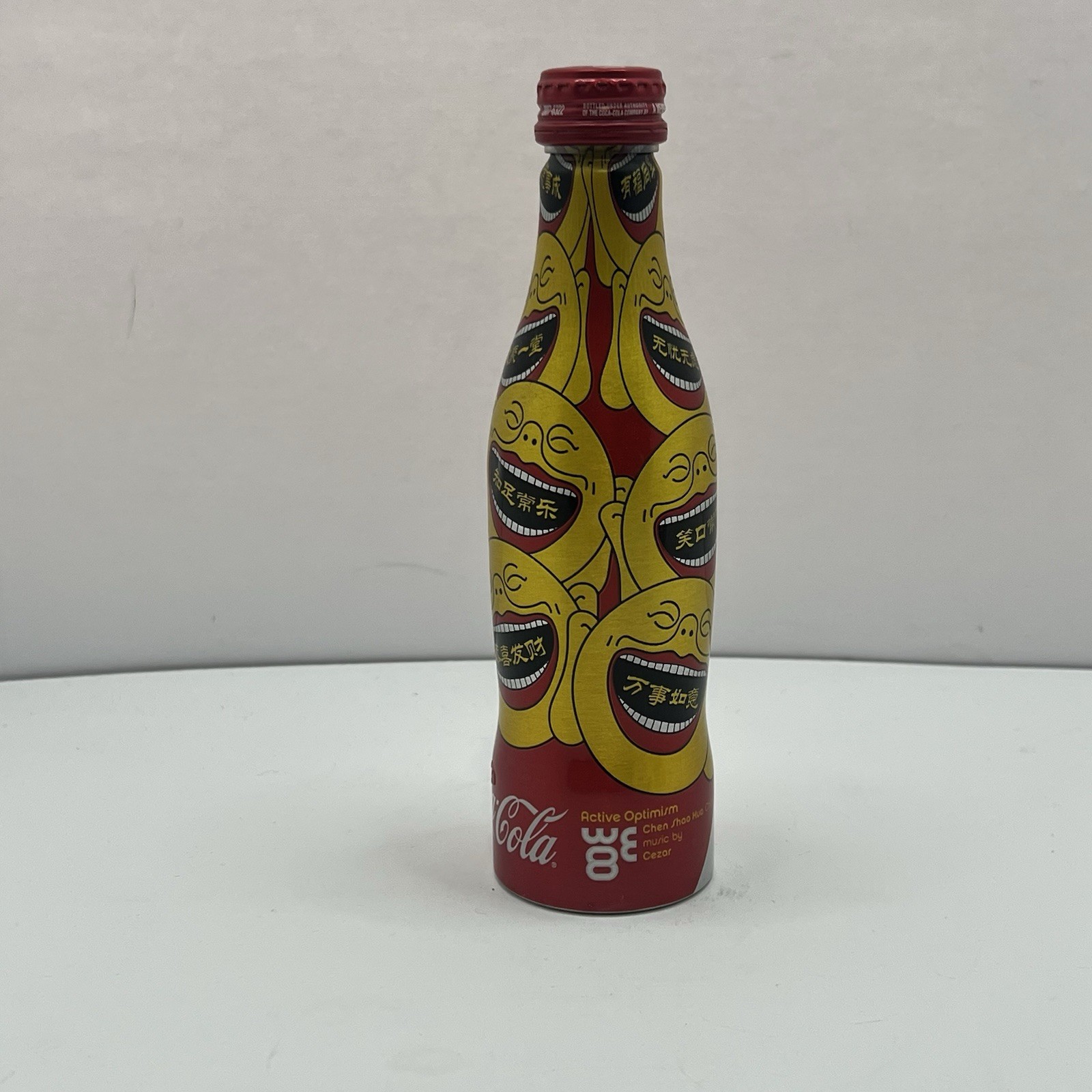 Coca - Cola 2008 WE8  8.5 Ounce Aluminum Bottle Sealed Coke Red Yellow Buddha