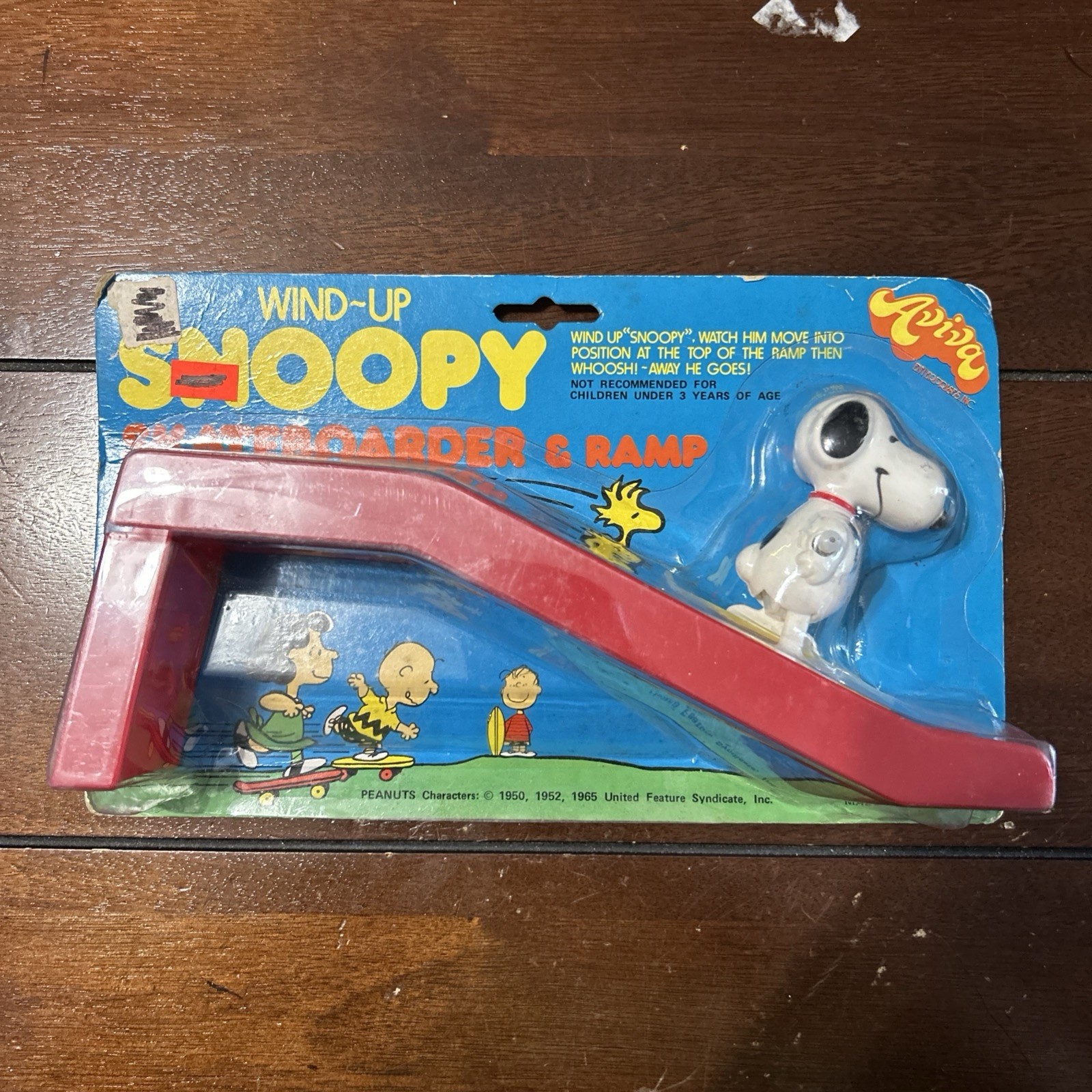 New MoC Vintage 1970s Aviva Snoopy Skateboarder and ramp wind up toy figure