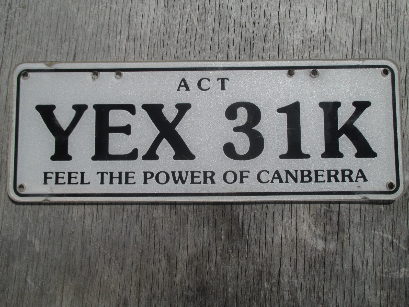 c2010 Australian Capital Territory white plastic Feel the Power license plate