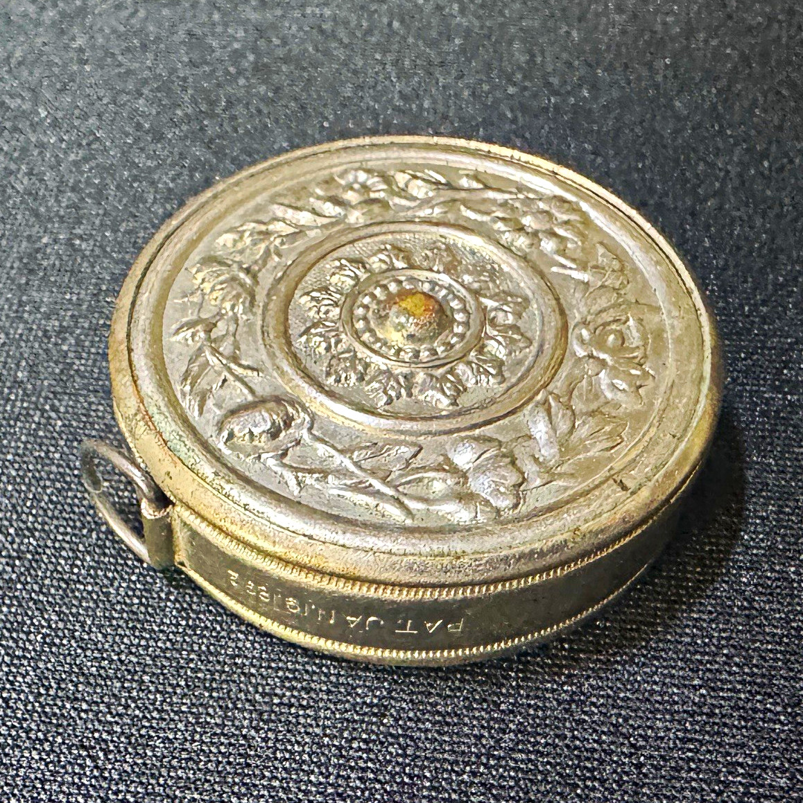 Vintage Ornate Metal Retractable Tape Measure Case Floral Embossed Jan.19.1892