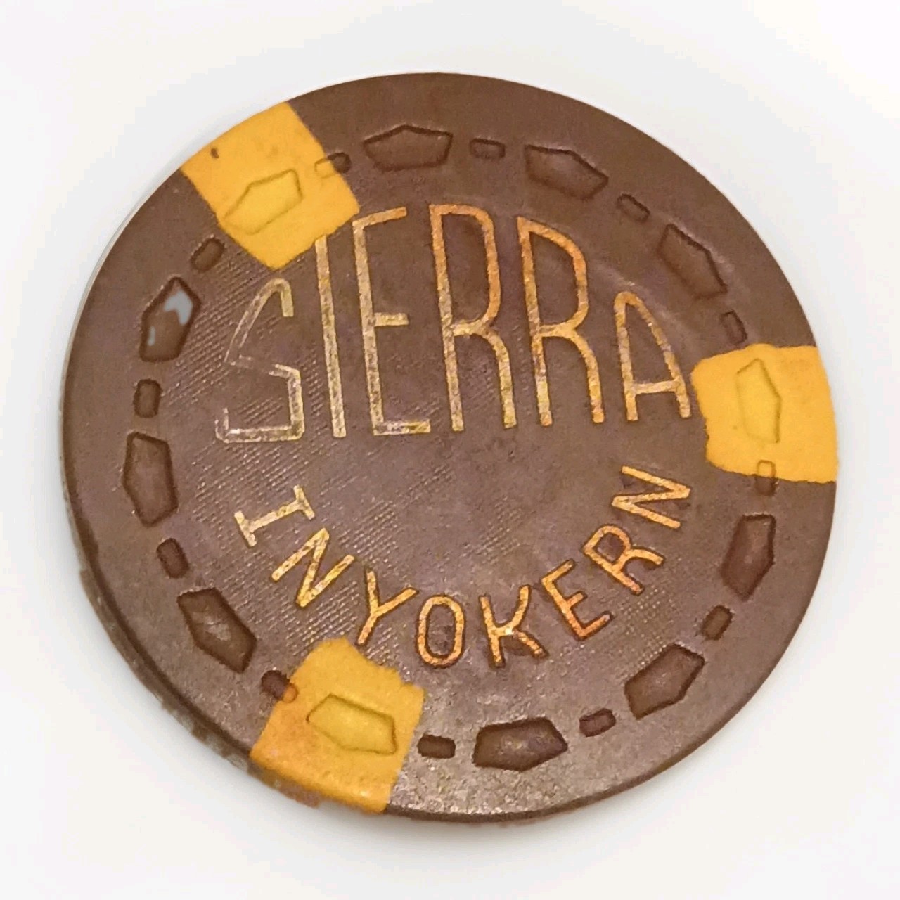 Sierra Inyokern $10 Casino Chip Brown w/ Yellow Accents Denomination
