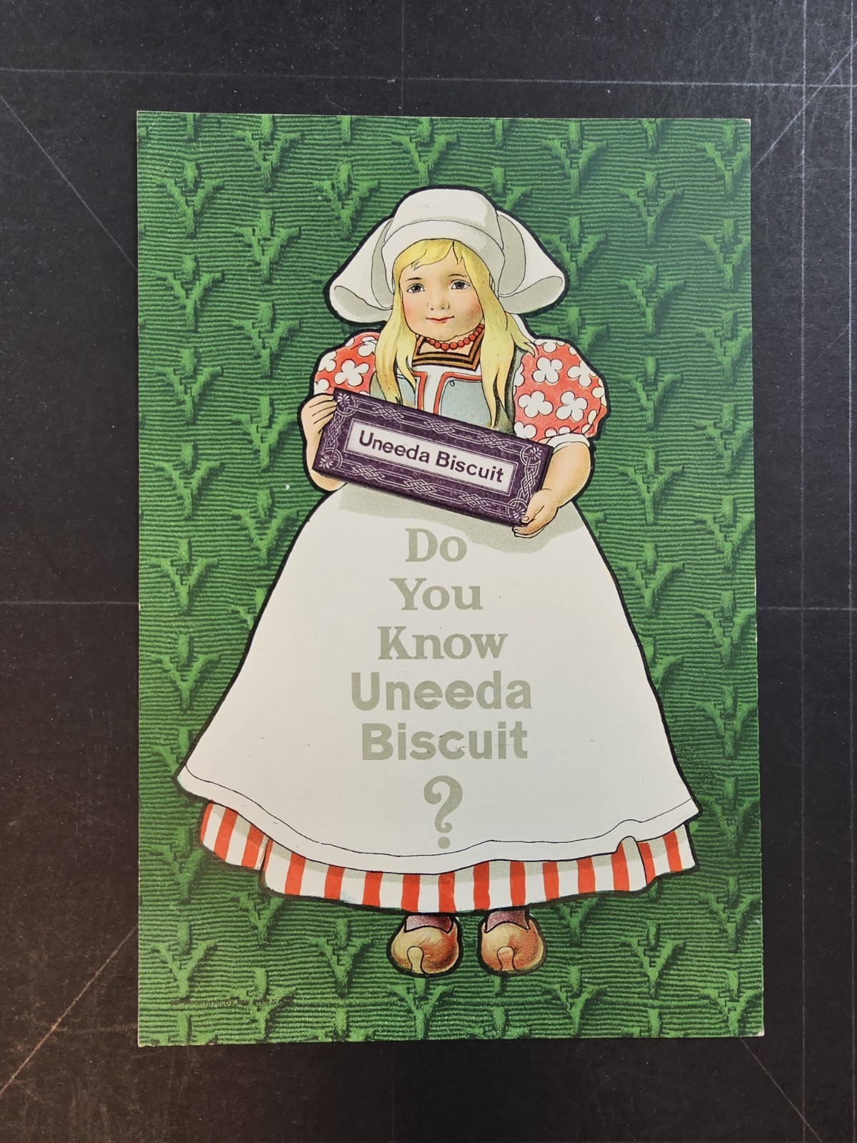 1901 two sided magazine ad for Uneeda Biscuits, little Dutch girl