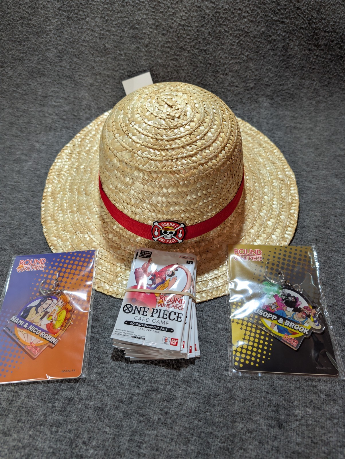 Round 1 One Piece English Promo Cards - Full Set of 10 + Keychains & Hat