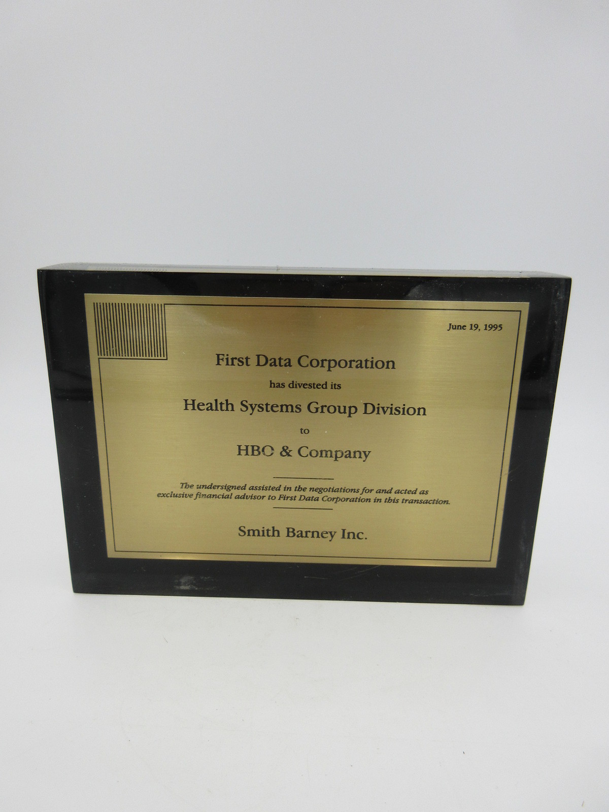 FIRST DATA CORP divested its HEALTH SYSTEMS GROUP TO HBO & CO LUCITE TOMBSTONE