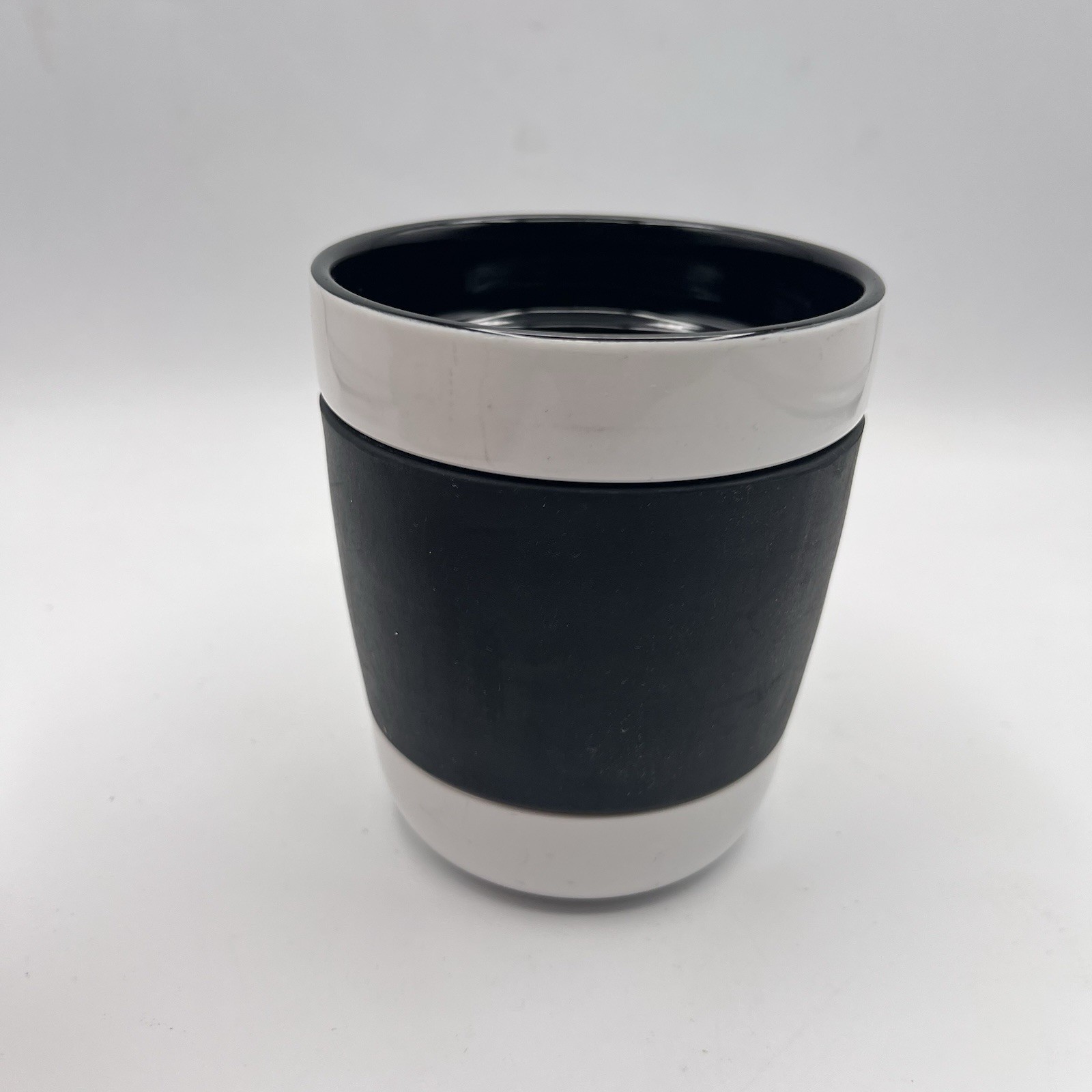 2009 Starbucks Coffee Mug Black & White Ceramic Handleless Silicone Grip 12 oz