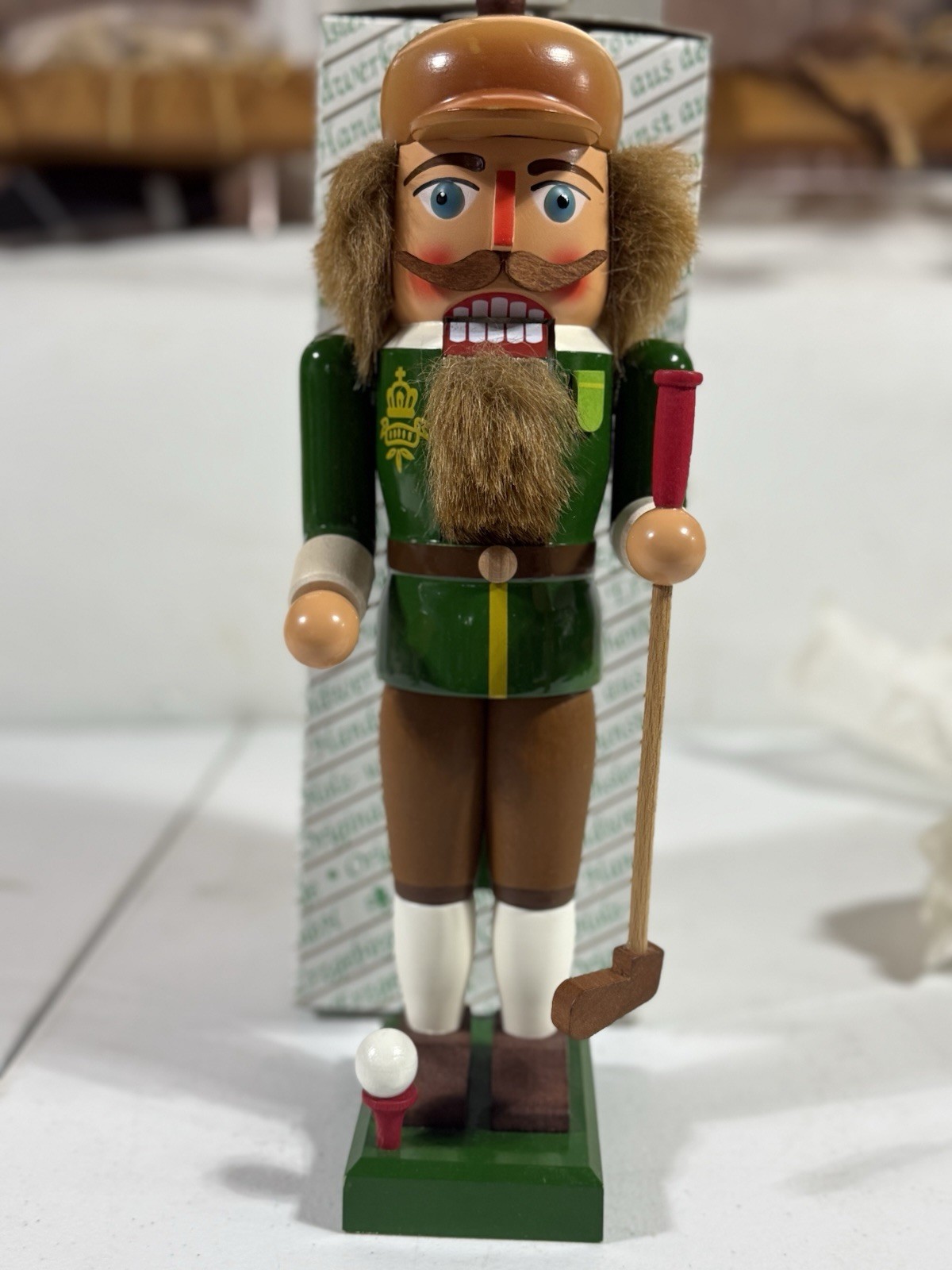 New in original box handcrafted German golfer nutcracker from Erzgebirge region