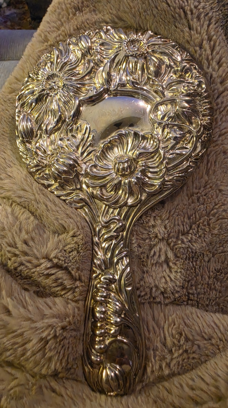 Vintage Silver-plated Handheld Vanity Mirror Featuring Ornate, Embossed Flower