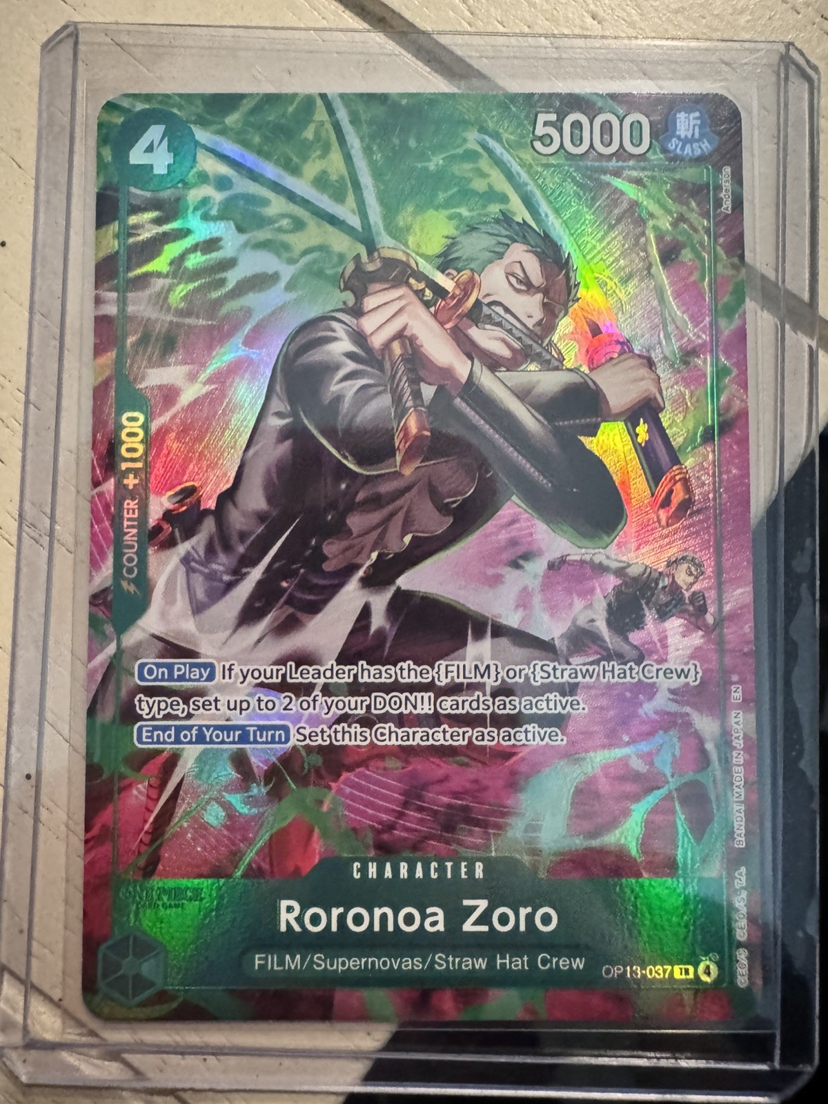 One Piece TCG OP-15/EB04 Roronoa Zoro OP13–037 Treasure Rare NM Looks PSA 10 