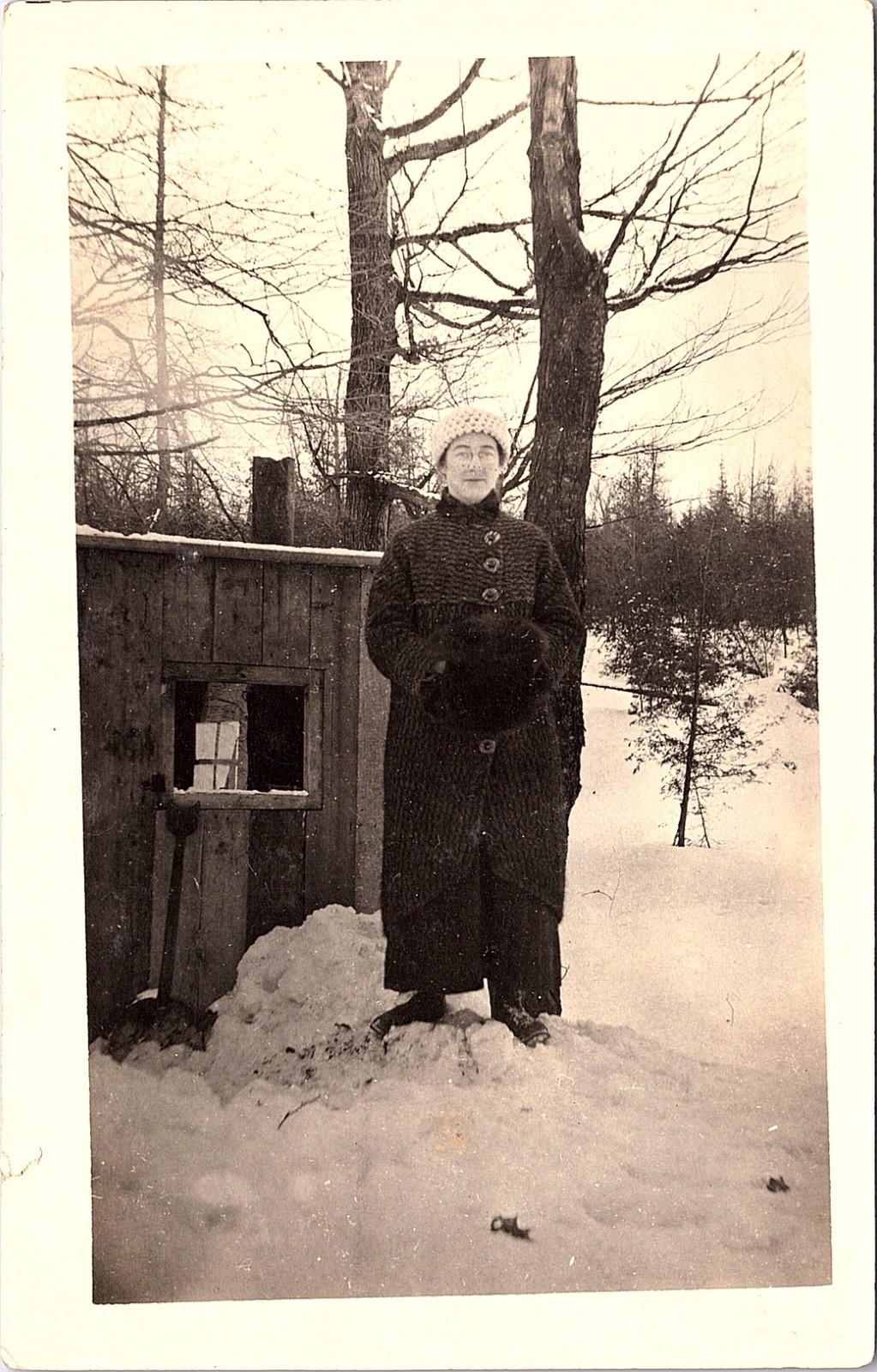 Woman in Winter Coat by Snowy Cabin, RPPC Rural Homestead Outdoor Postcard
