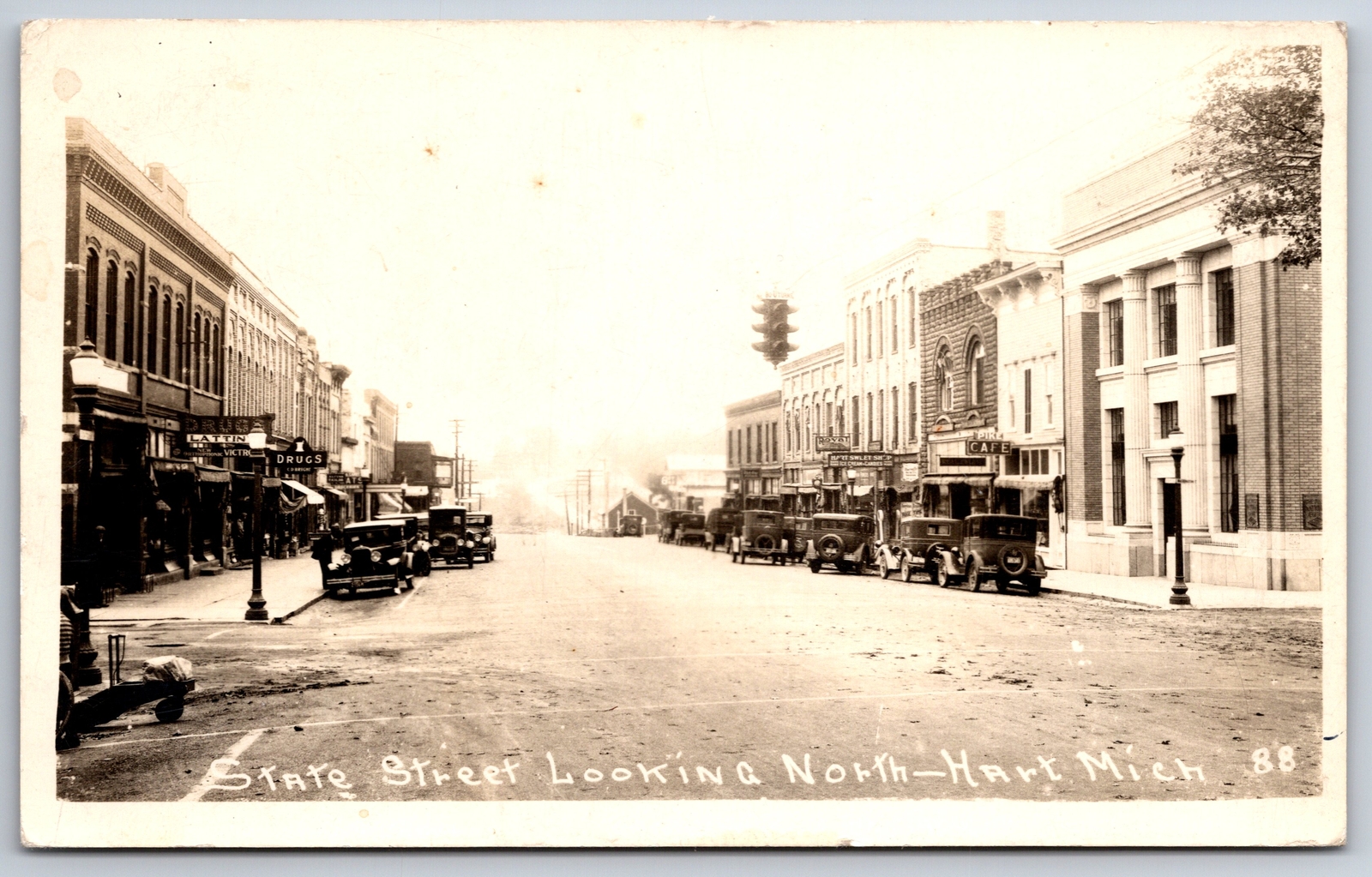 Hart Michigan~State St~Sweet Shop~Pike Cafe~Big Bank w/Columns~RPPC 1920s