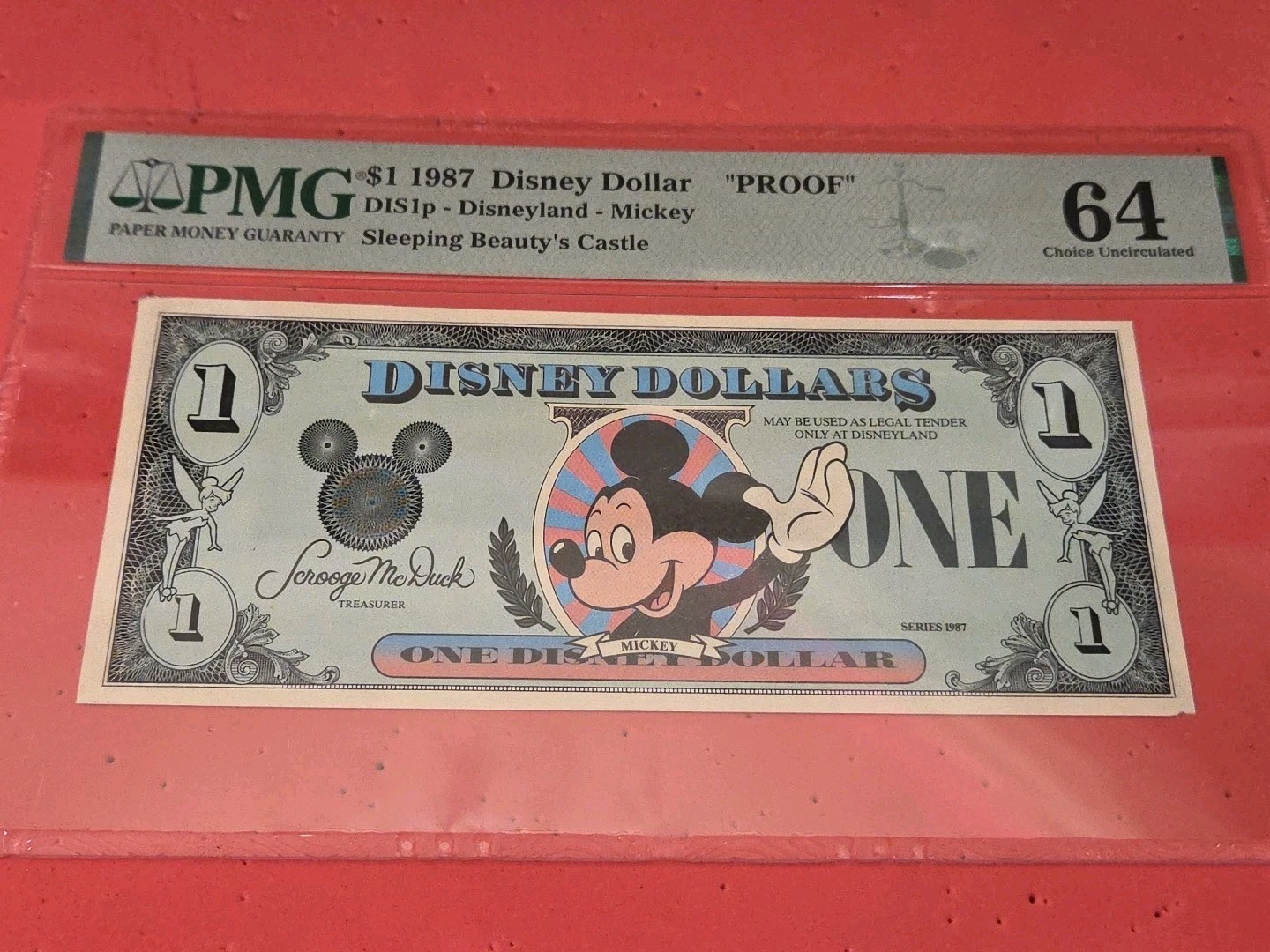 1987 $1 PROOF Disney Dollar Mickey DIS1p Disneyland PMG 64 Choice Uncirculated