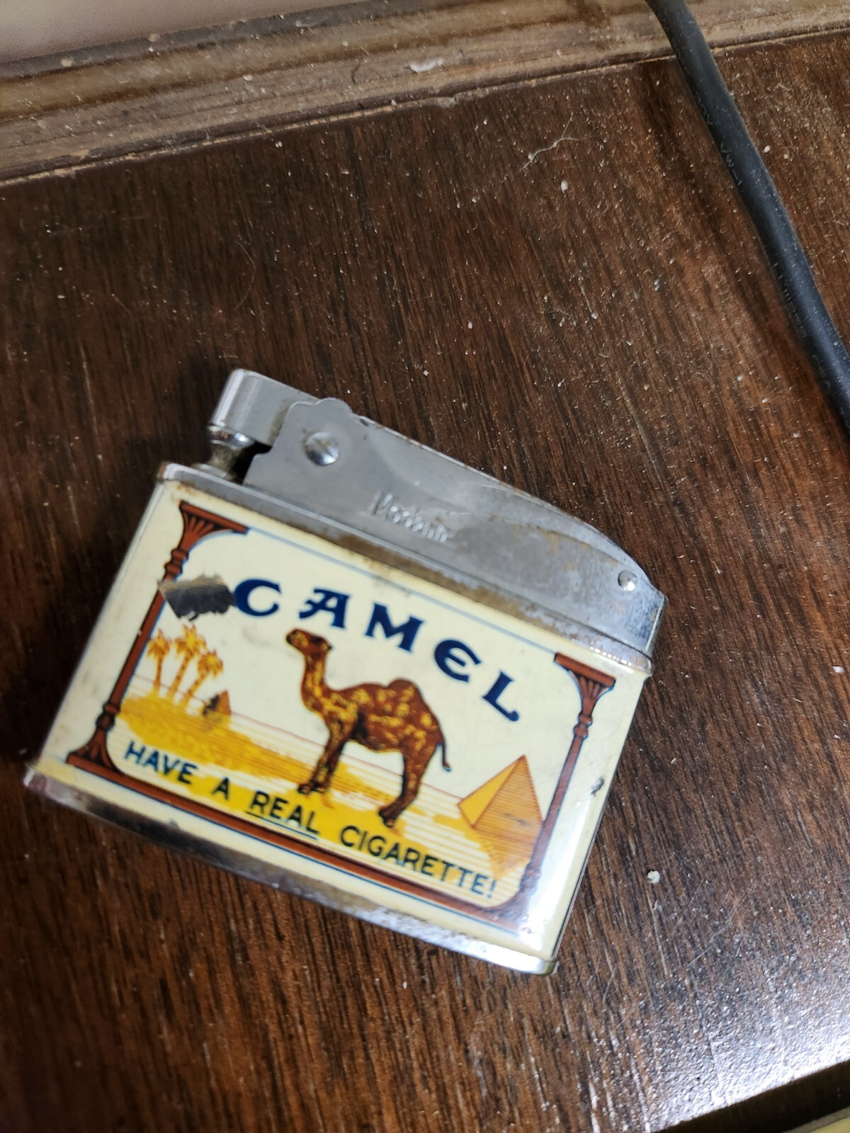 VINTAGE ANTIQUE CAMEL CIGARETTE LIGHTER 2”x1.75” “HAVE A REAL CIGARETTE”