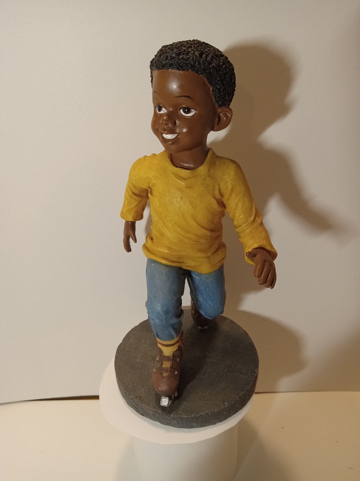 AFRICAN AMERICAN BOY ROLLER SKATING RESIN FIGURINE 7.5 INCHES, PAINTED