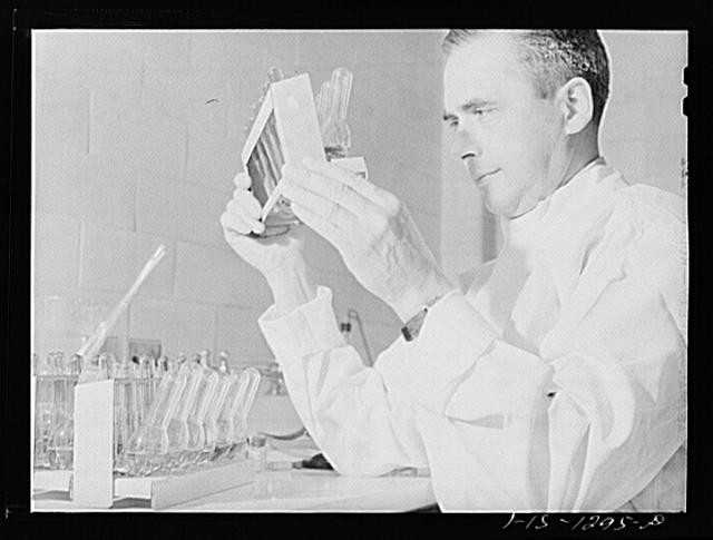 Photo:1950s Vaccine Sterility Test Laboratory Scientist Holding Vials