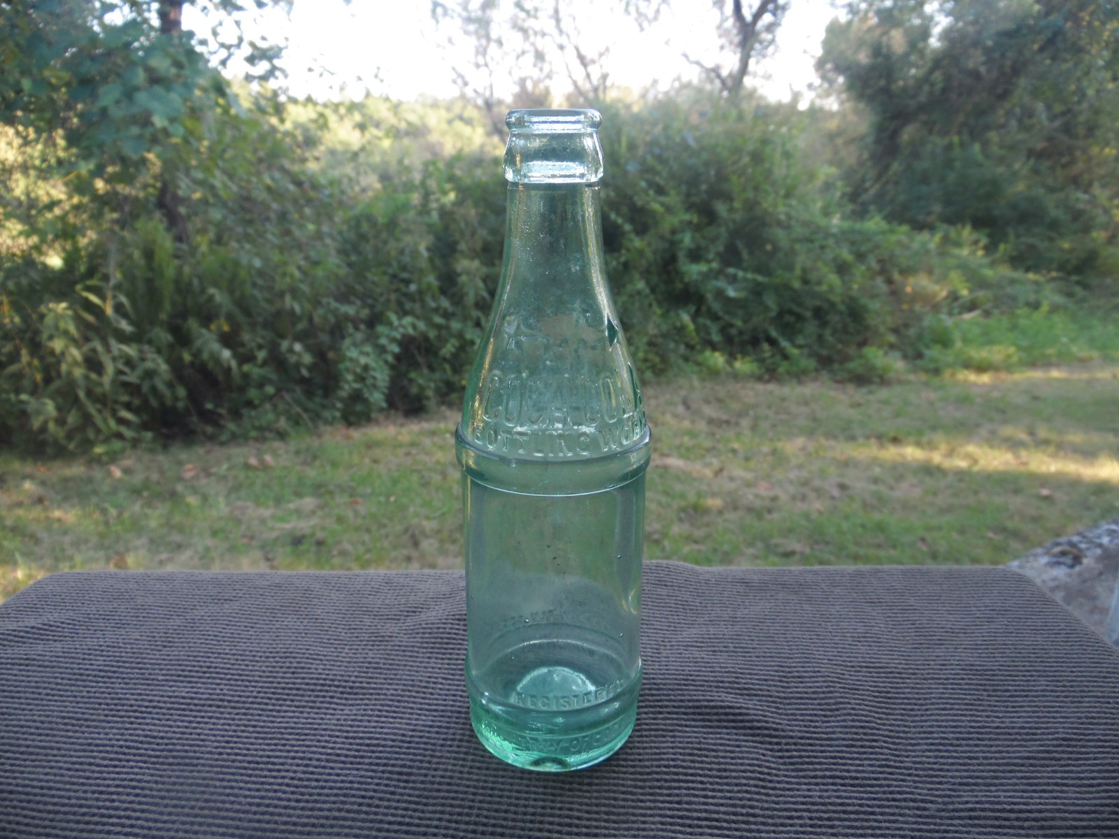 VINTAGE LIGHT GREEN STRAIGHT SIDE COCA COLA BOTTLE LOUISVILLE,KY CIRCA 1920's.
