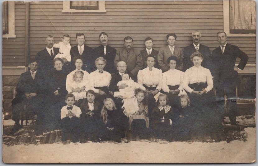 Vintage 1910s Photo RPPC Postcard Large Family Posing on Side of House / Winter