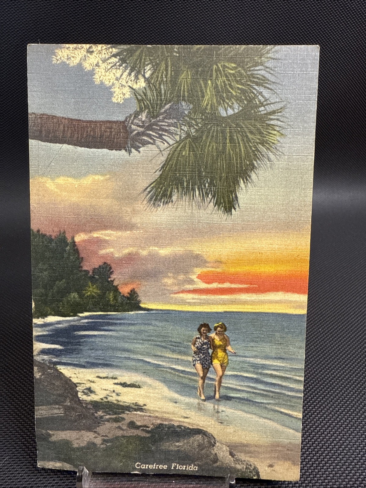 Postcard FL Carefree Florida Ladies Affectionate Walking Along Shore Sunset