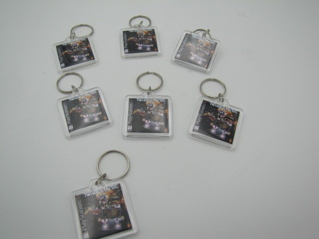 Lot of 7 Twisted Metal PS1 Keychains