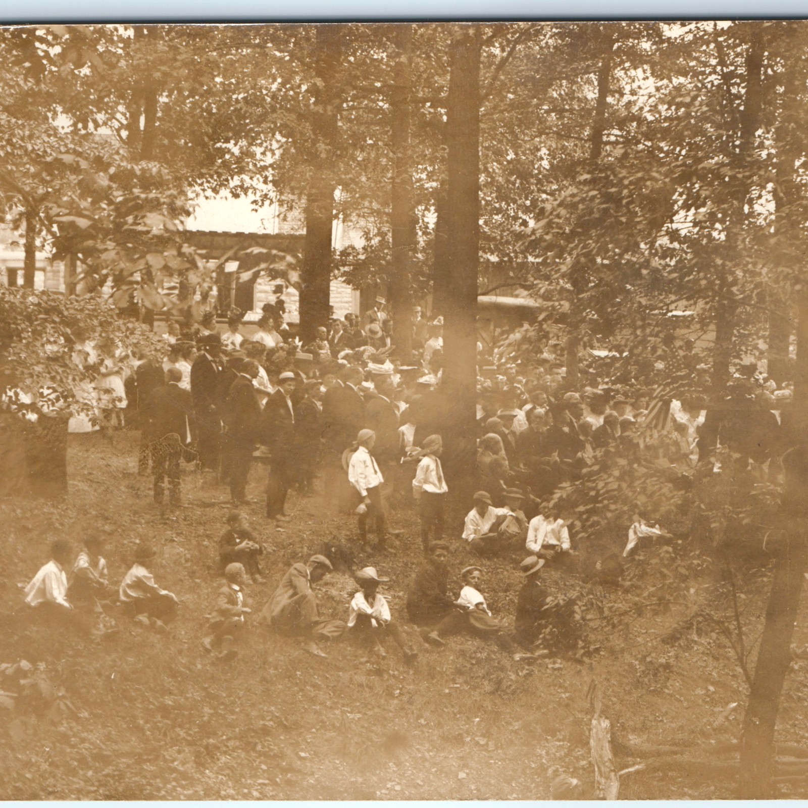 c1910s Large Community Picnic Woods RPPC Postcard Pergola Boater Hats Kids Flag
