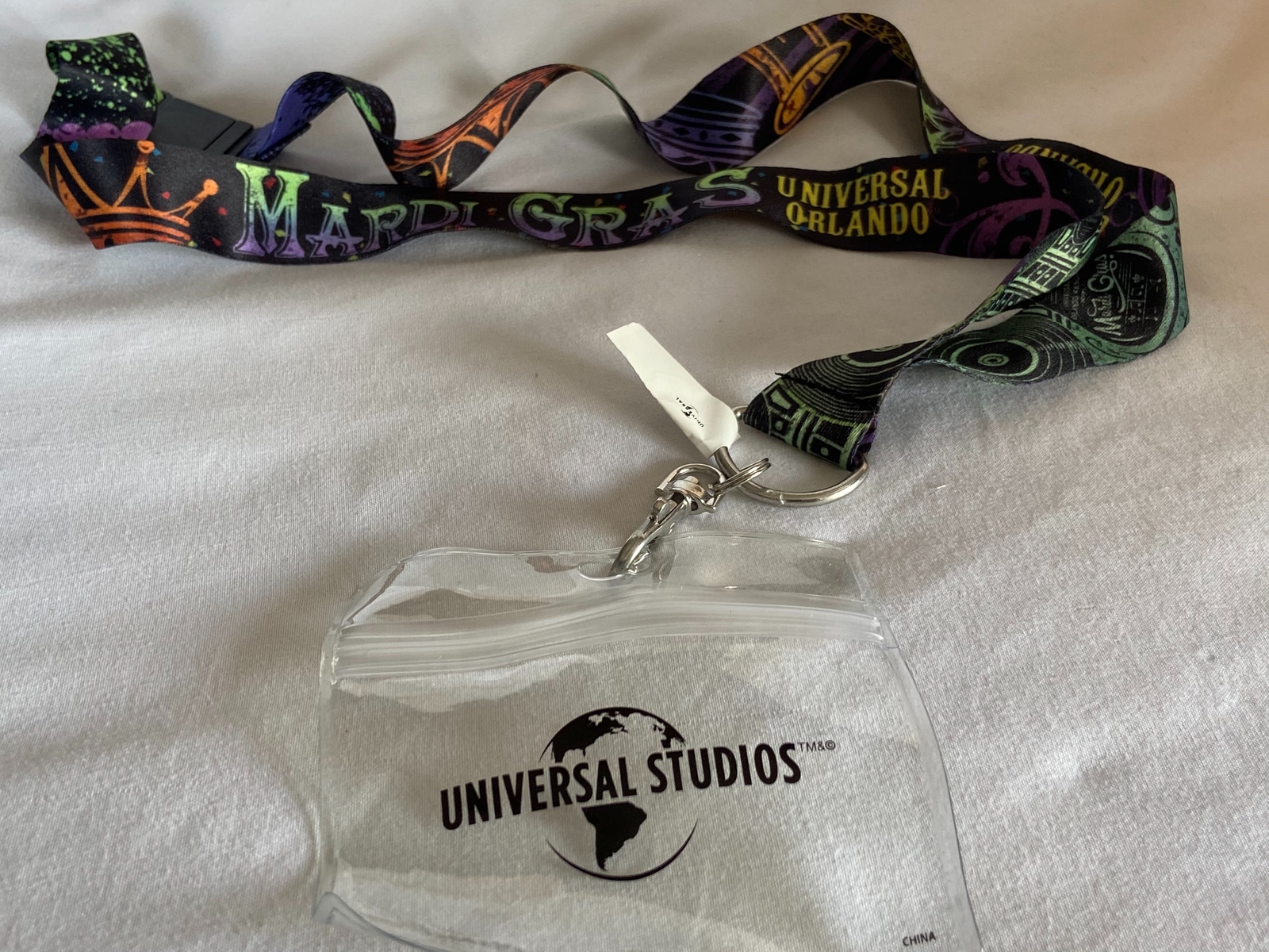 NEW Universal Studios Mardi Gras Lanyard 2020 W/ ID Holder Purple Green Trumpet