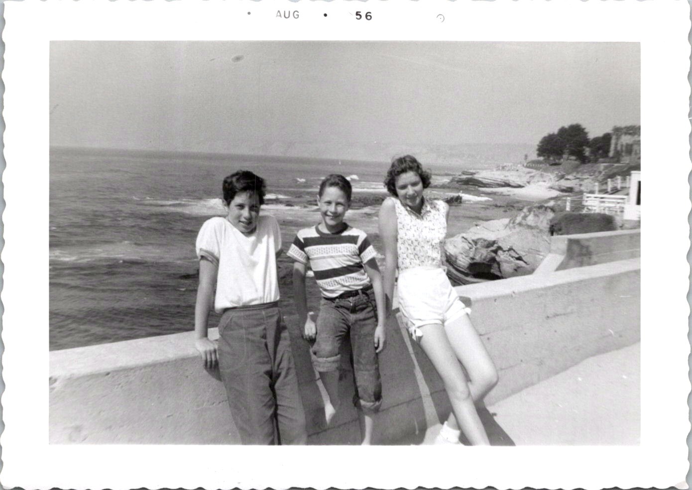 Three Kids on Oceanfront Seawall, 1956 California Coast B&W Snapshot Photo