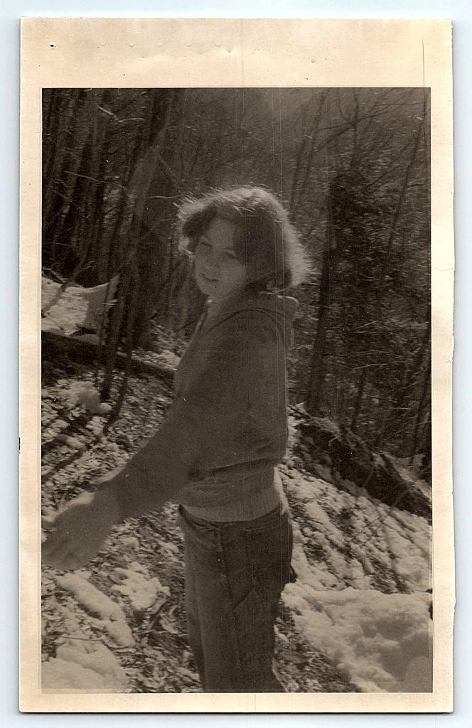 Black & White Photograph 1980's Woman in Woods on Snowy Hill