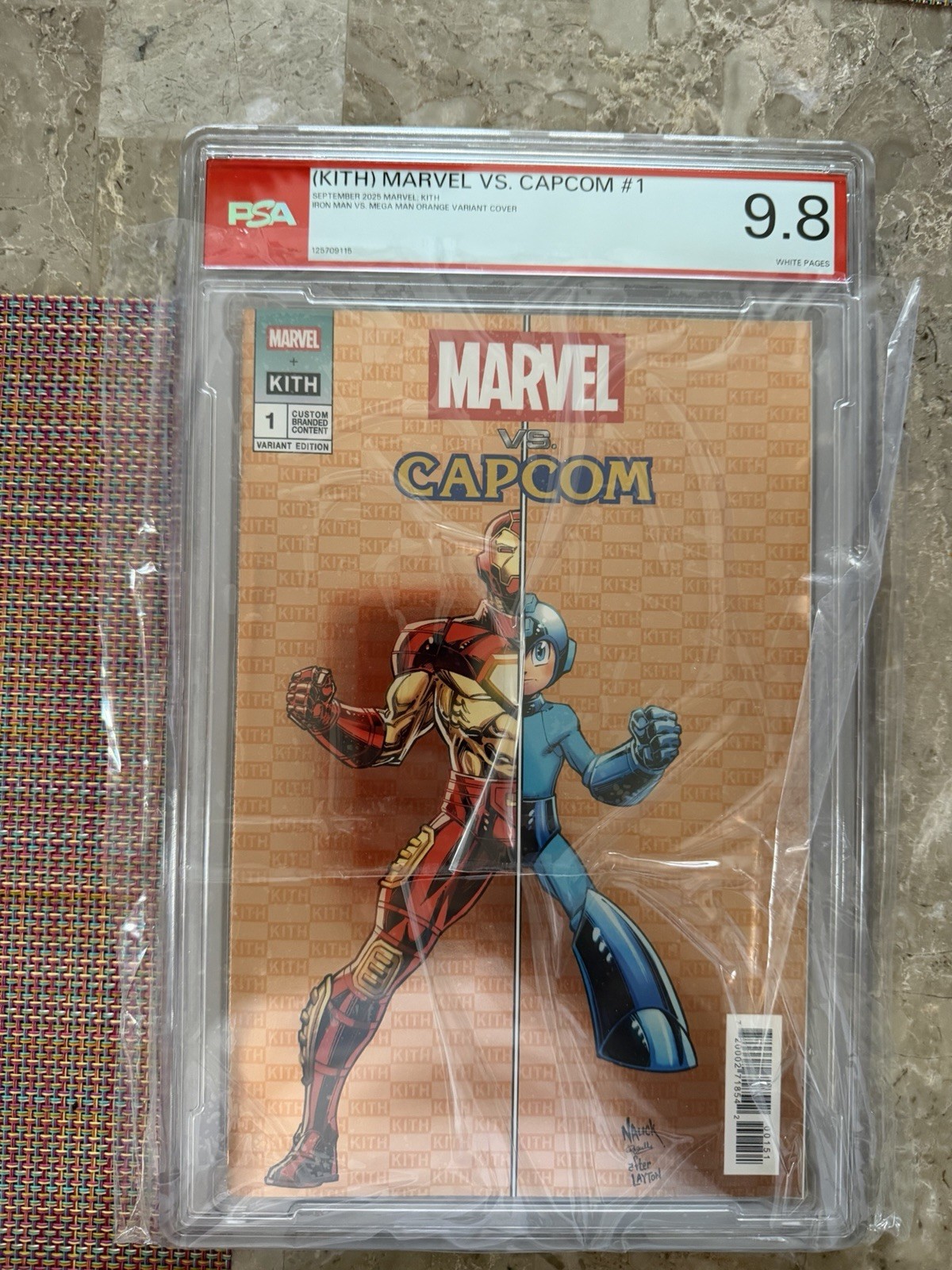 KITH MARVEL VS. CAPCOM #1 2025 ORANGE IRON MAN VS MEGA MAN VARIANT PSA 9.8