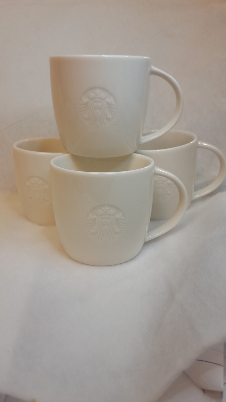 STARBUCKS 2010 Coffee Mug White Siren Mermaid Logo Embossed S