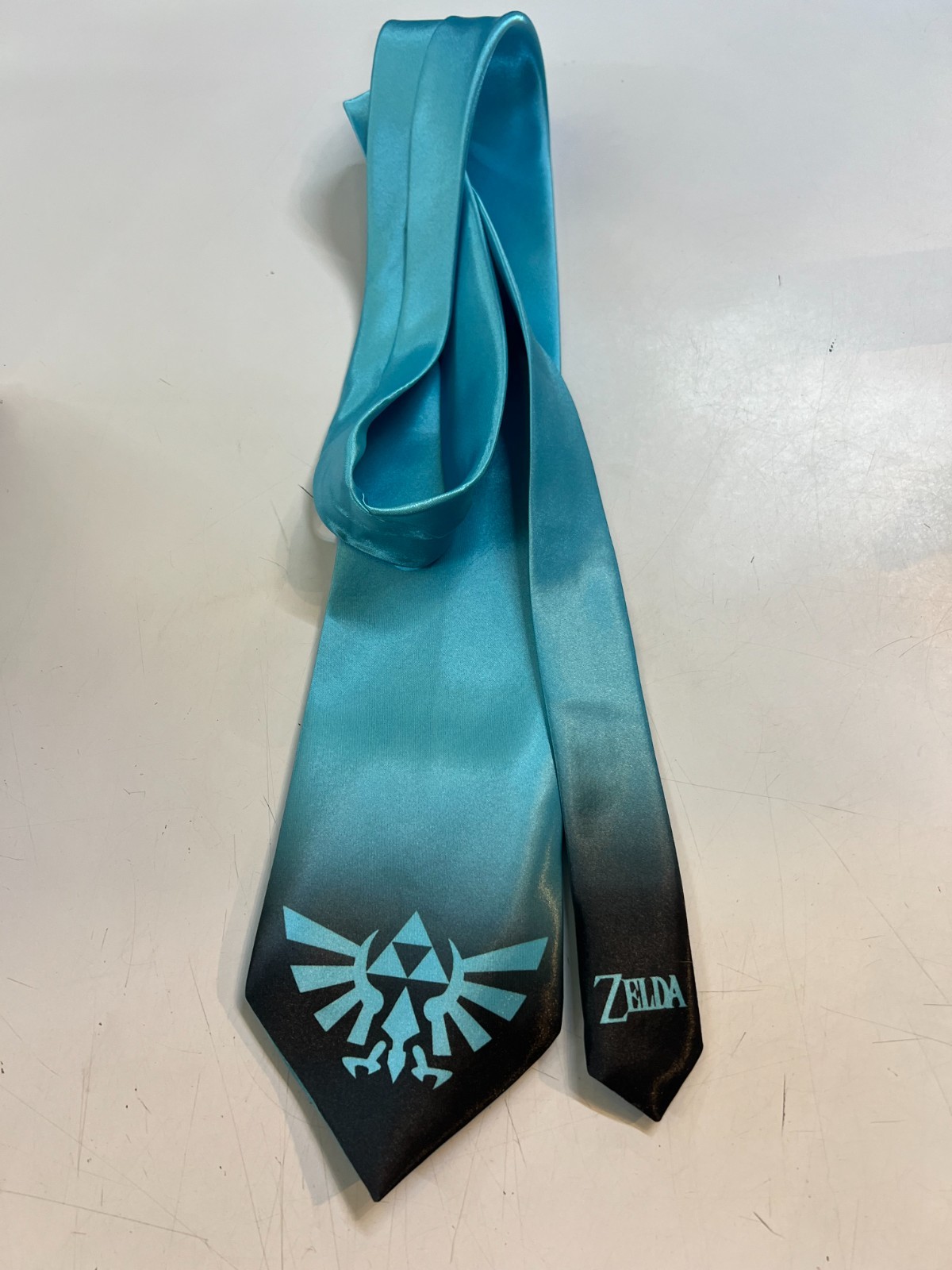 L@@K Legend of Zelda -Triforce Symbol Imprinted on a Light Blue Neck Tie