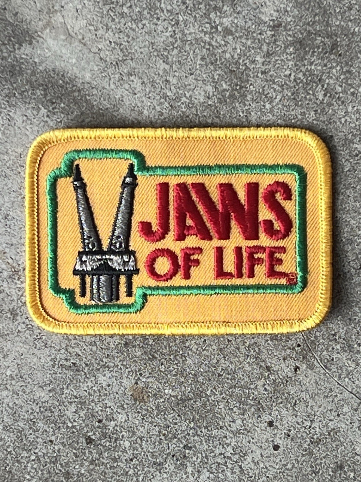 Vintage New Old Stock  Jaws Of Life Patch w Tool In Vertical Position  RARE