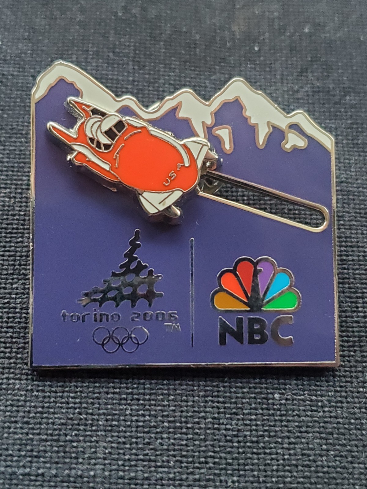 Torino 2006 Olympic 2 man bobsled NBC pin. Very rare. Bobsled slides.