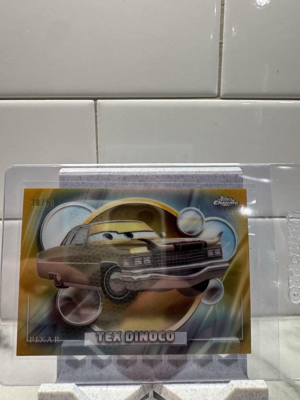Topps 2006 Disney/Pixar Cars Chrome Tex Dinoco #19 Serial #/50