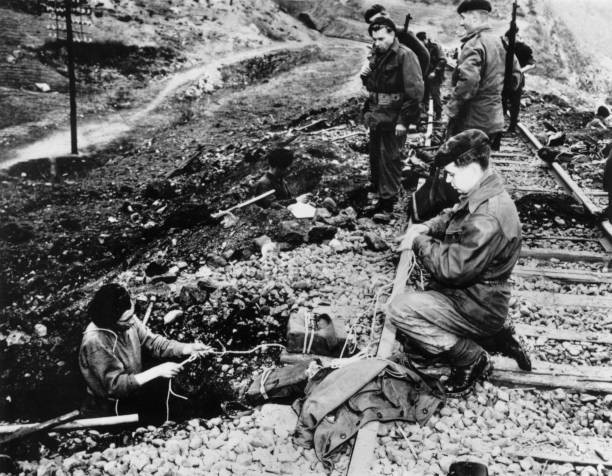 Team of commandos prepare to blow up a railway line behind enemy l- Old Photo