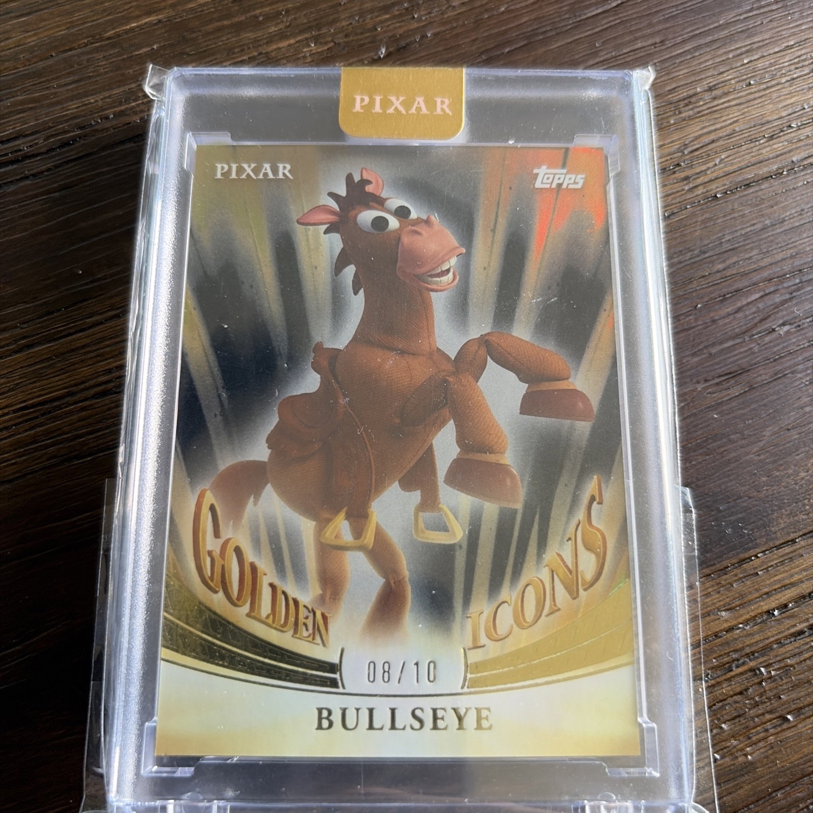 2025 Topps Pixar Gold Bullseye Golden Icons Encased Black 8/10