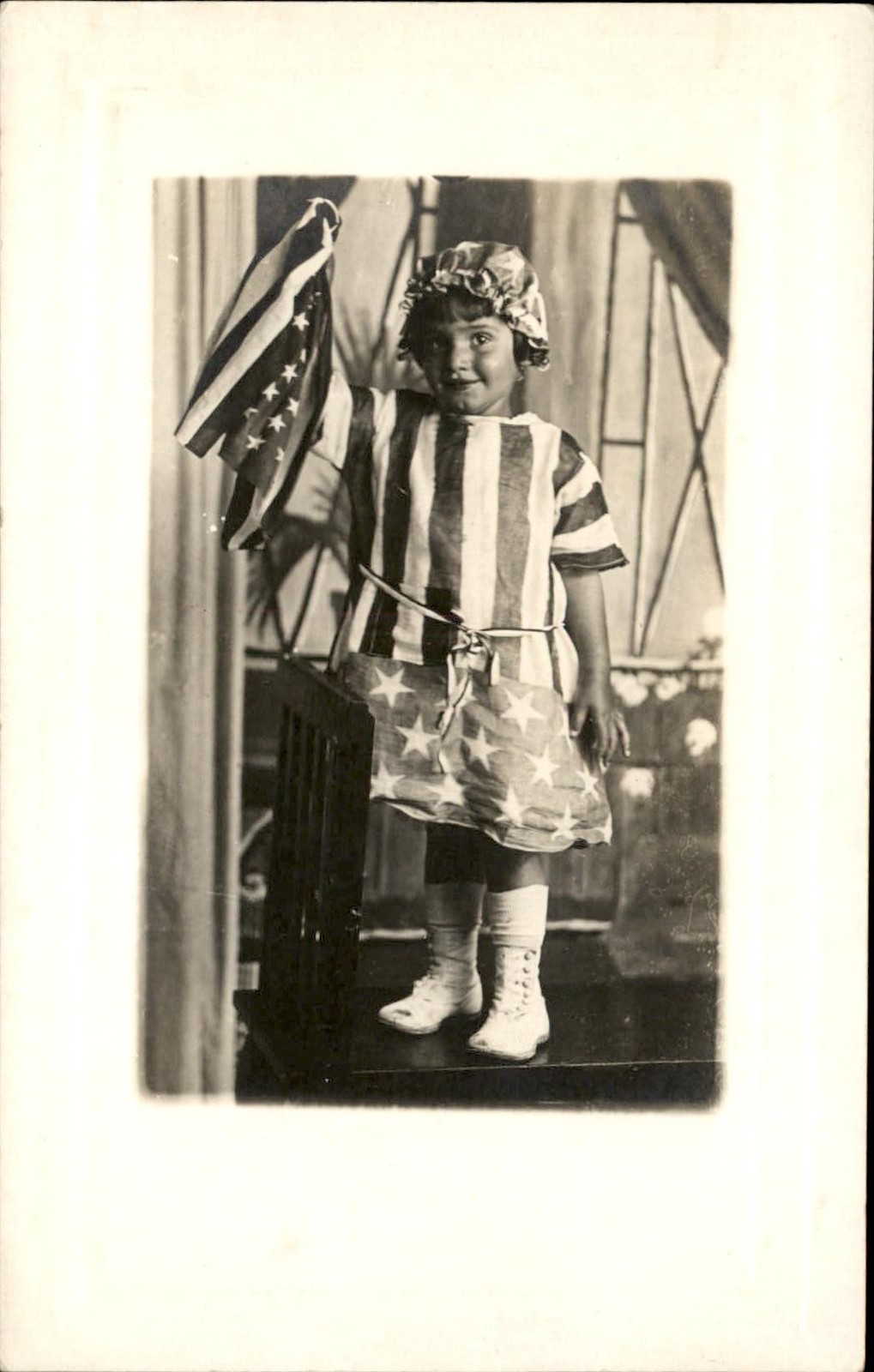 Patriotic little girl Decked Out American Flag Outfit c1910s RPPC Postcard bhn