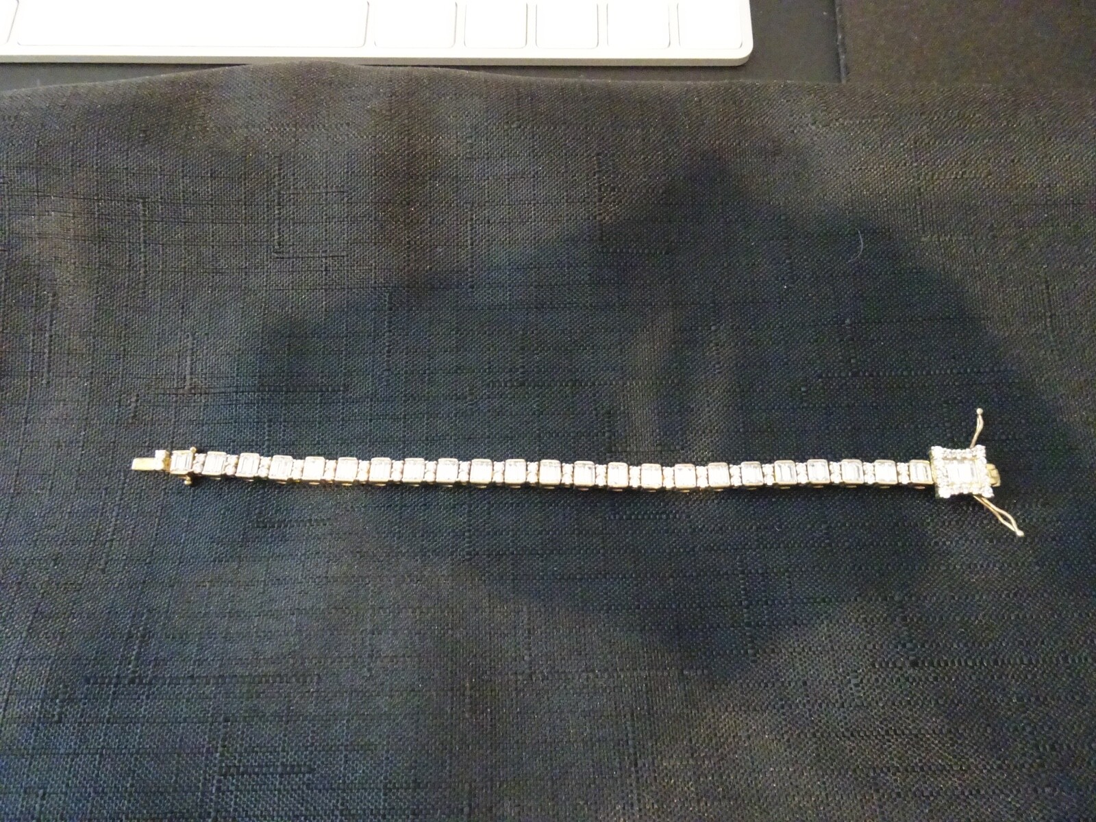 #433--STERLING SILVER TENNIS BRACELET-925- LOADED WITH STONES-GOLD COLOR