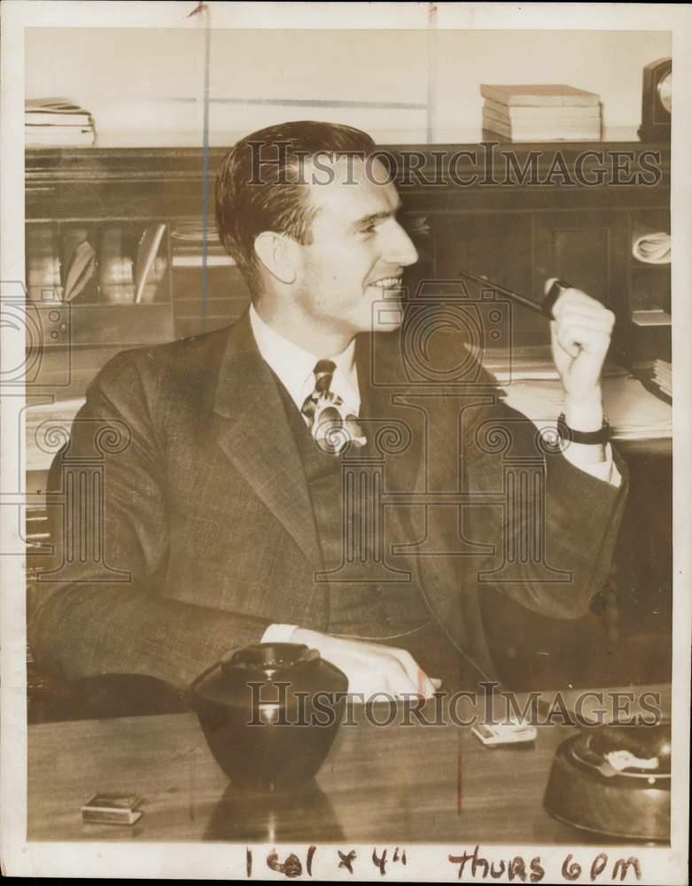 1939 Press Photo John D. Rockefeller, 3rd smokes a pipe in his office