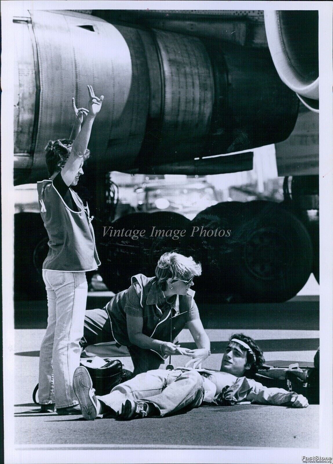 1979 Aviation Safety Drill Woman Practices Medical Exercise Planes Photo 7x9