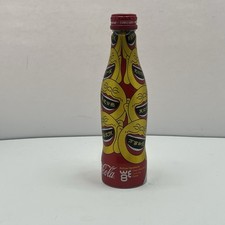 Coca - Cola 2008 WE8  8.5 Ounce Aluminum Bottle Sealed Coke Red Yellow Buddha picture