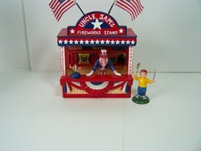 Dept 56 Uncle Sam’s Fireworks Stand 2Pc Figures #54974 Retired Pre-Owned picture