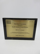 FIRST DATA CORP divested its HEALTH SYSTEMS GROUP TO HBO & CO LUCITE TOMBSTONE picture