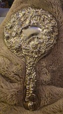 Vintage Silver-plated Handheld Vanity Mirror Featuring Ornate, Embossed Flower picture