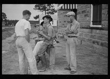 Photo:1930s Men Group Outdoor Conversation Building Bench Street Scene picture