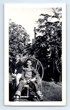 Old Vintage Photo BOY AND GIRL SITTING IN CHAIR BACKYARD ANTIQUE SNAPSHOT picture