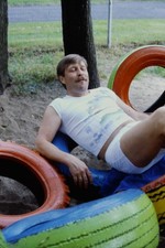 c1970's 35mm Slide, Man Resting Tires Playground Park Scene blue orange green picture