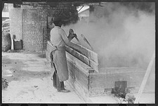 Photo:Statesboro Georgia 1930s Turpentine Works Worker at Vat FSA picture