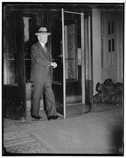 Photo:1939 1940 Man in Suit Hat Exits Building Revolving Door Interior picture