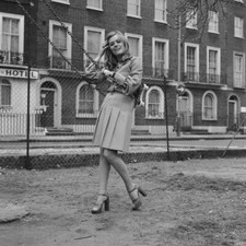 English television actress Wendy Richard poses by a child's swing - Old Photo picture