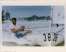 1990 Ocean Sailboat Man Sailing City Skyline Photo 8x10 picture